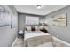Cozy bedroom with natural light, neutral walls, and wood-look flooring at 7902 Meade St # A10, Westminster, CO 80030