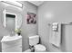 Clean half bath with round mirror, neutral walls, and modern fixtures at 7902 Meade St # A10, Westminster, CO 80030