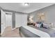 Spacious bedroom features neutral paint, closet, and wood-look flooring at 7902 Meade St # A10, Westminster, CO 80030