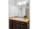 Bathroom sink with dark cabinets and a light countertop at 3408 S Kittredge St, Aurora, CO 80013