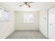 This bedroom features plush carpet and a large window providing ample natural light at 3408 S Kittredge St, Aurora, CO 80013