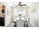 Well-lit dining area boasts a modern chandelier and table that seats six at 3408 S Kittredge St, Aurora, CO 80013