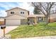 Charming two-story home boasts a manicured front lawn and a combination brick and siding exterior at 3408 S Kittredge St, Aurora, CO 80013