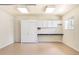 Garage area featuring pegboard, cabinets, countertop and an overhead light at 3408 S Kittredge St, Aurora, CO 80013