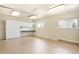 Garage area featuring pegboard, cabinets, countertop, an overhead light and a window at 3408 S Kittredge St, Aurora, CO 80013
