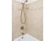 Bathroom shower with tiled wall and a handheld shower head at 3408 S Kittredge St, Aurora, CO 80013