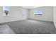 Bright, carpeted bedroom with large windows and ample natural light at 25204 E Warren Pl, Aurora, CO 80018