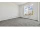 Bright, carpeted bedroom with large window and ample natural light at 25204 E Warren Pl, Aurora, CO 80018