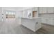 Open-concept kitchen featuring a center island, sleek countertops, and ample cabinet space at 25204 E Warren Pl, Aurora, CO 80018