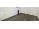 This laundry room features wood-look vinyl plank flooring at 25204 E Warren Pl, Aurora, CO 80018