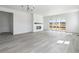 Spacious living room featuring a fireplace, hardwood floors, and sliding glass doors to the outside at 25204 E Warren Pl, Aurora, CO 80018