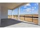Covered patio overlooking natural landscape and blue skies at 25204 E Warren Pl, Aurora, CO 80018