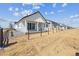 New single story home with white siding and black trim at 25204 E Warren Pl, Aurora, CO 80018