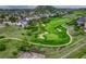Aerial view of a golf course near a residential neighborhood at 2775 Morningbird Ln, Castle Rock, CO 80109