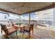 Cozy covered deck with comfortable seating, string lights, and panoramic neighborhood views at 2775 Morningbird Ln, Castle Rock, CO 80109