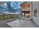 Home featuring a covered balcony, a concrete patio, and a grassy backyard at 2775 Morningbird Ln, Castle Rock, CO 80109