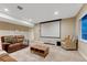 Basement media room featuring plush seating and a large projection screen at 2775 Morningbird Ln, Castle Rock, CO 80109