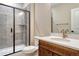 Tiled bathroom with a glass shower and modern fixtures at 2775 Morningbird Ln, Castle Rock, CO 80109