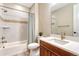 Bright bathroom with modern fixtures, stylish tile, and a combined shower-tub at 2775 Morningbird Ln, Castle Rock, CO 80109