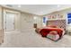Spacious bedroom features neutral walls, carpet, and a tufted headboard bed with accent pillows at 2775 Morningbird Ln, Castle Rock, CO 80109