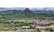 Distant view of community featuring scenic mountain range and commercial buildings at 2775 Morningbird Ln, Castle Rock, CO 80109