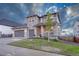 Stylish two-story home with a three-car garage and well-manicured front lawn at 2775 Morningbird Ln, Castle Rock, CO 80109