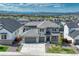 Aerial view of a grand two-story home with three-car garage in a Gathering-friendly neighborhood at 2775 Morningbird Ln, Castle Rock, CO 80109