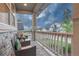 Cozy front porch seating area with chairs and serene neighborhood views at 2775 Morningbird Ln, Castle Rock, CO 80109