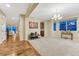 Open-concept living room with wood floors and natural light, perfect for entertaining at 2775 Morningbird Ln, Castle Rock, CO 80109