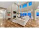 Bright living room with high ceilings, fireplace, balcony, and large windows with beautiful view at 2775 Morningbird Ln, Castle Rock, CO 80109