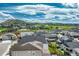 Aerial view of a new neighborhood with green spaces and mountain views at 2775 Morningbird Ln, Castle Rock, CO 80109