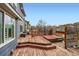 Wooden deck featuring a hot tub and built in grilling area at 5163 Apache Creek Rd, Castle Rock, CO 80109