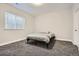A simply staged bedroom with plush carpeting and a well-lit window at 1403 Hart Ln, Elizabeth, CO 80107