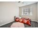 Cozy bedroom with plush carpet, bright natural light, and a decorative rug at 1403 Hart Ln, Elizabeth, CO 80107