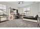 Multi-use bedroom with carpet floor, ceiling fan, and built-in aquarium at 1403 Hart Ln, Elizabeth, CO 80107