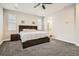 Light-filled bedroom with carpet flooring and an attached bathroom area at 1403 Hart Ln, Elizabeth, CO 80107
