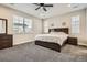 Comfortable bedroom with neutral walls, carpet, and a large window offering natural light at 1403 Hart Ln, Elizabeth, CO 80107