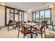 Bright community room with tables, chairs, and a sliding barn door feature at 1403 Hart Ln, Elizabeth, CO 80107