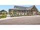 Community clubhouse featuring a modern architectural design with covered seating at 1403 Hart Ln, Elizabeth, CO 80107
