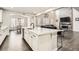Open kitchen and living area featuring an island with seating, and a view to the dining room and living room at 1403 Hart Ln, Elizabeth, CO 80107