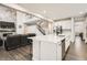 Bright, modern kitchen features an island, stainless appliances, and seamless flow to the living area at 1403 Hart Ln, Elizabeth, CO 80107