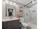Updated bathroom with marble shower, modern fixtures, neutral colors, and lots of lighting at 10657 Cherrybrook Cir, Highlands Ranch, CO 80126