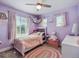 Lovely bedroom with a playful color scheme, two windows and themed decor at 10657 Cherrybrook Cir, Highlands Ranch, CO 80126