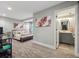 Modern bedroom with carpet floor, stylish decor, and an ensuite bathroom at 10657 Cherrybrook Cir, Highlands Ranch, CO 80126