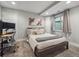 Modern bedroom with carpet floor, stylish decor, and lots of natural light at 10657 Cherrybrook Cir, Highlands Ranch, CO 80126