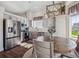 Bright eat-in kitchen with stainless appliances, white cabinets, and hardwood floors at 10657 Cherrybrook Cir, Highlands Ranch, CO 80126
