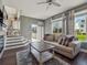 Spacious living room featuring a fireplace, a large window, and stylish flooring at 10657 Cherrybrook Cir, Highlands Ranch, CO 80126