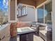 Outdoor patio with comfortable seating, stone accents, and covered area for relaxation at 10657 Cherrybrook Cir, Highlands Ranch, CO 80126