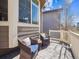 Charming outdoor porch featuring wicker chairs and a cozy ambiance for relaxation at 10657 Cherrybrook Cir, Highlands Ranch, CO 80126