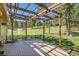 Backyard deck with wood pergola, offering shaded outdoor living space at 29551 Dorothy Rd, Evergreen, CO 80439
